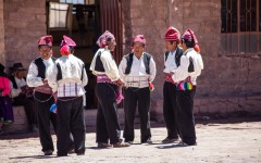 Group of married Taquile men in the main square