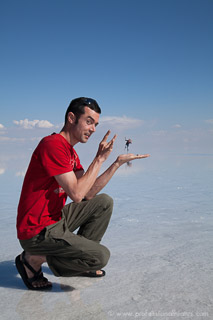 Salar de Uyuni, tiny girl in hand of boy