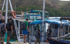 Climbing aboard boat to visit Komodo Island