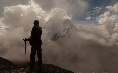 Laura overlooking the Himalayas as storm clouds move in